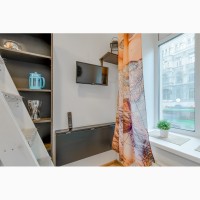 Тематическая двухуровневая квартира-студии в центре Санкт-Петербурга
